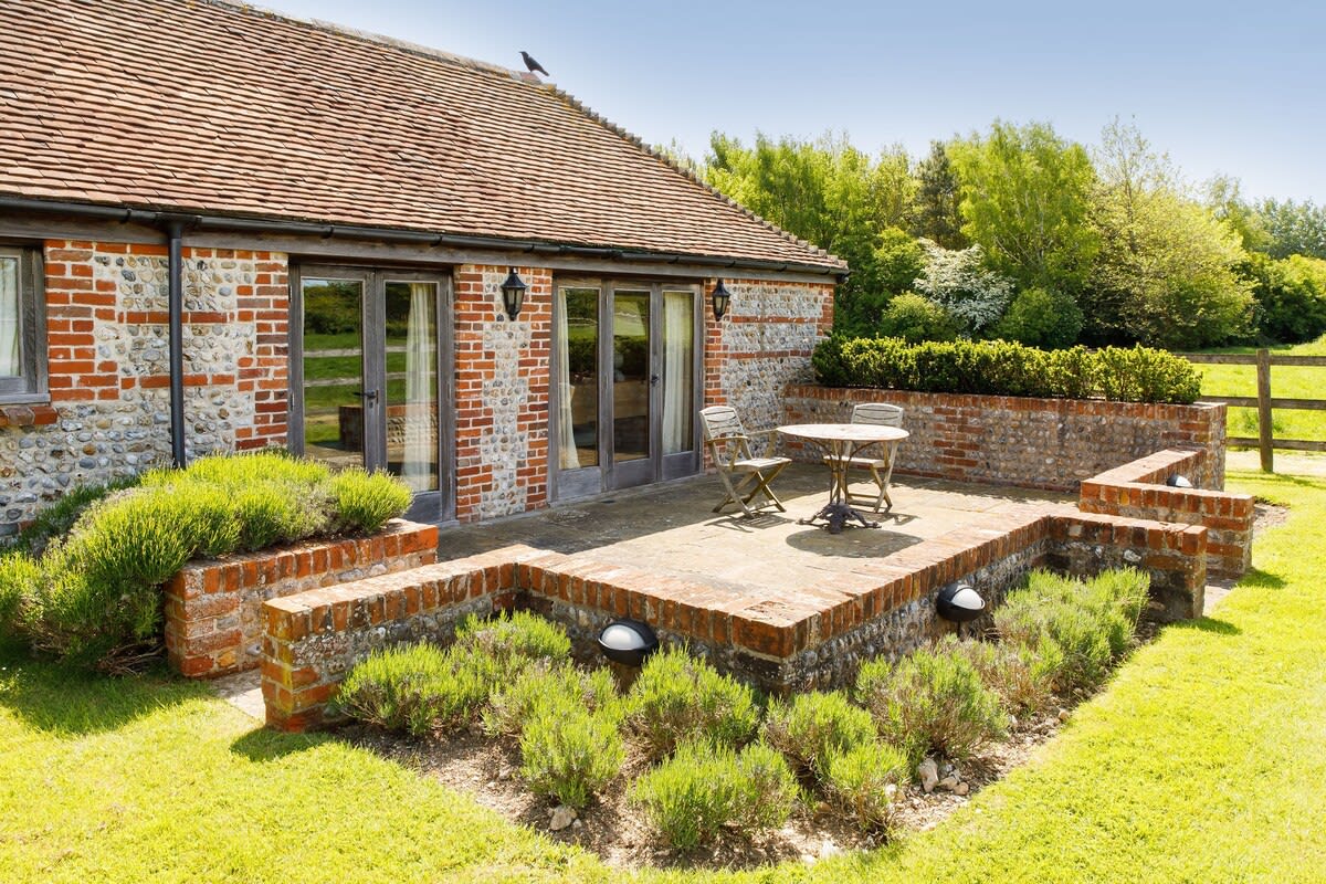 There is a pretty terraced area at the rear of The Cottage for a morning coffee or an evening drink.