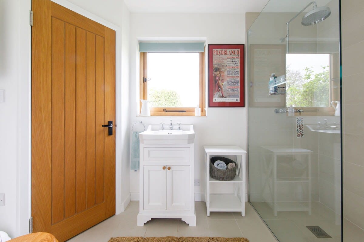 The ensuite has a large walk-in shower, WC and sink.