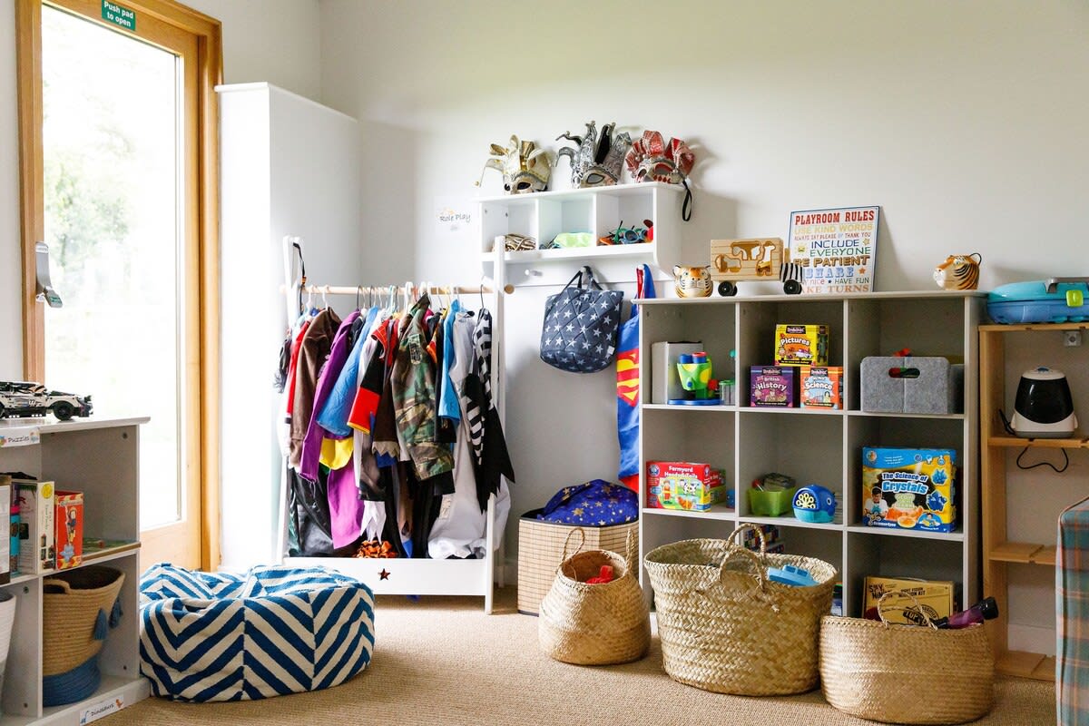 Explore books, toys and dressing up in The Barn's playroom.