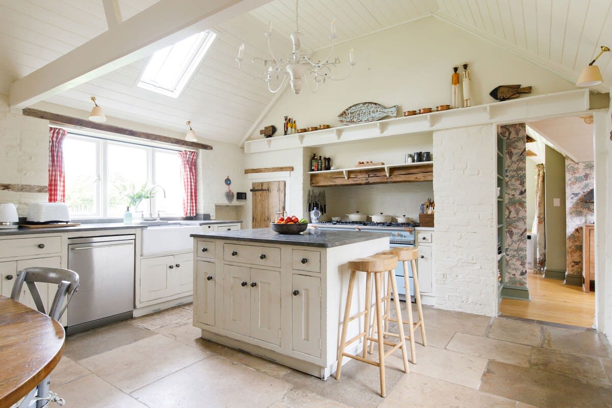 The farmhouse kitchen has everything you need to prepare meals, including an impressive Lacanche range.