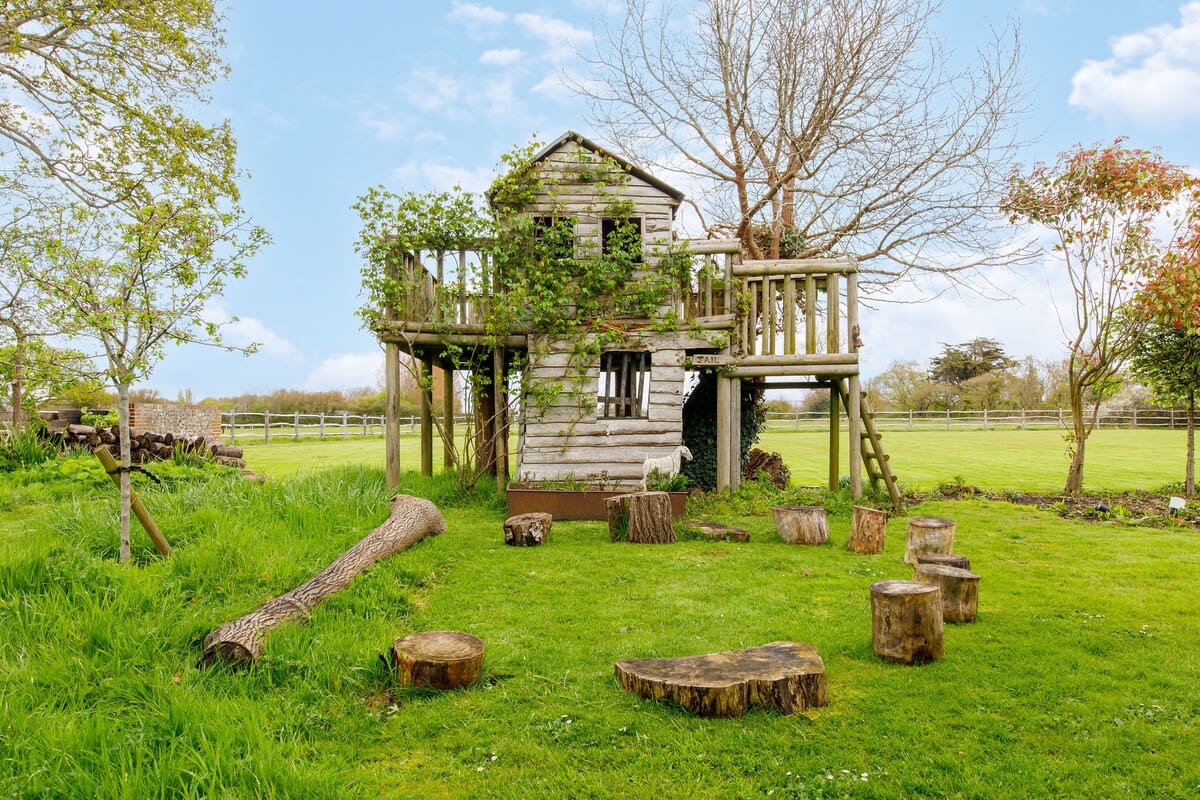 There is an amazing treehouse and outdoor playground for children.