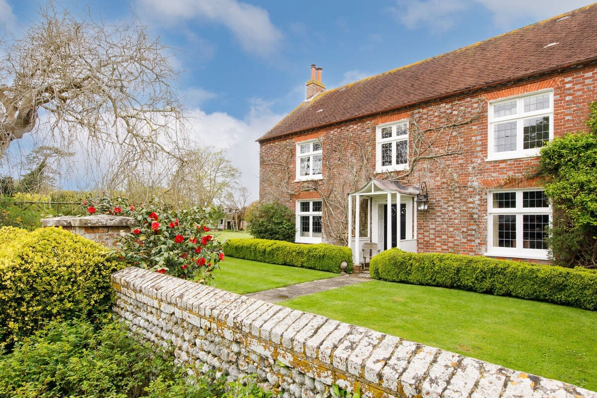 The 17th Century home retains many original features and is surrounding by beautifully manicured grounds.