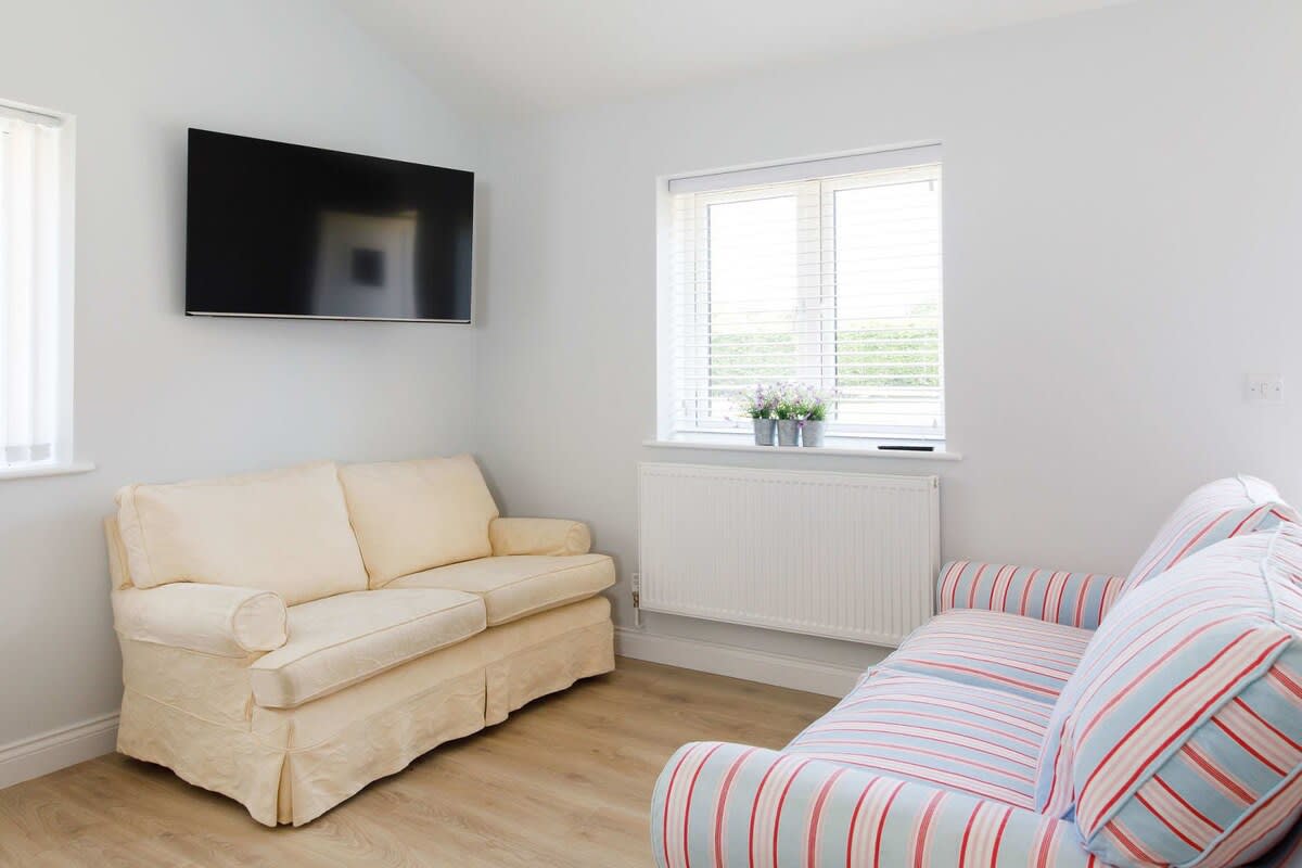 There are two comfy sofas and a Smart TV to catch up on your favourite shows.