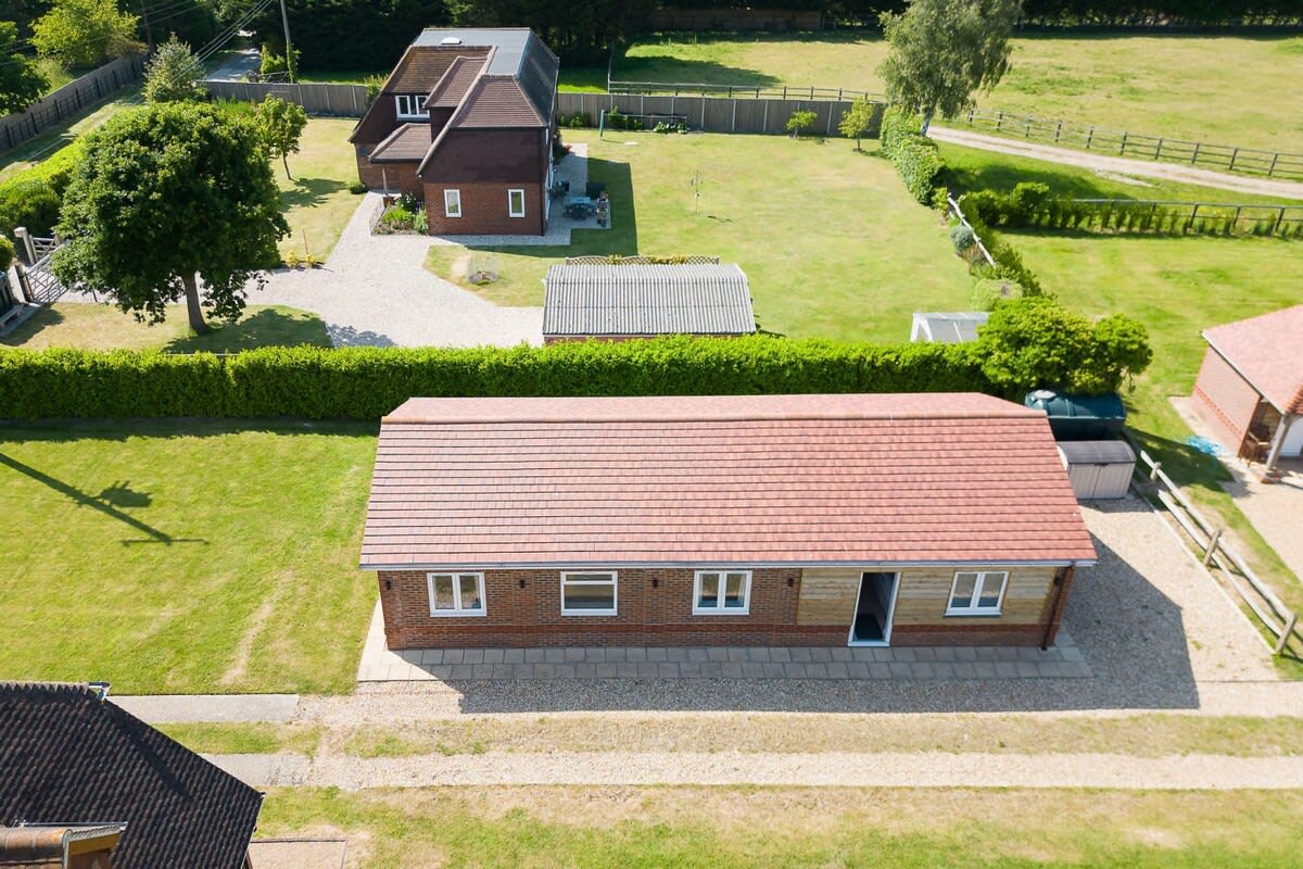 Enjoy the surrounding countryside, lawns and trees.