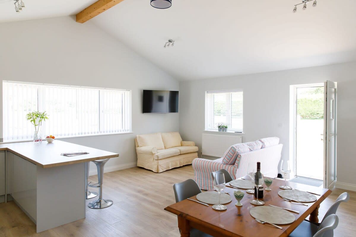 Enjoy long, leisurely meals or evening games at the dinning table that seats 6..