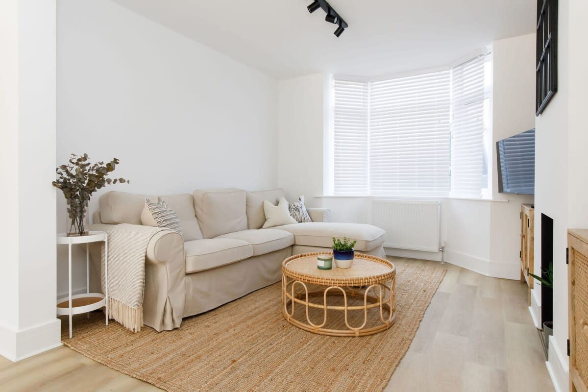 The living room has a large sofa, comfy cushions and cosy throws. Enjoy a film or curl up with a good book and coffee.