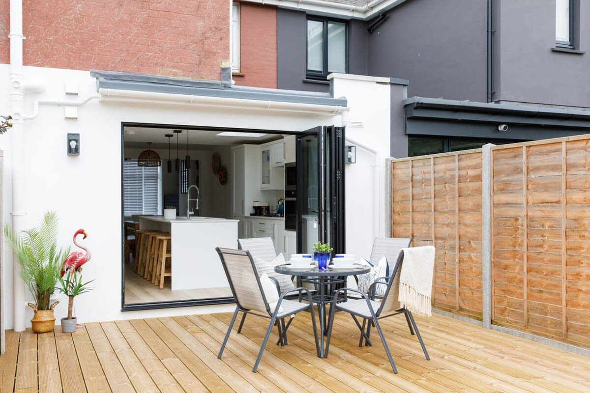 The home has comfy garden furniture for alfresco dining.