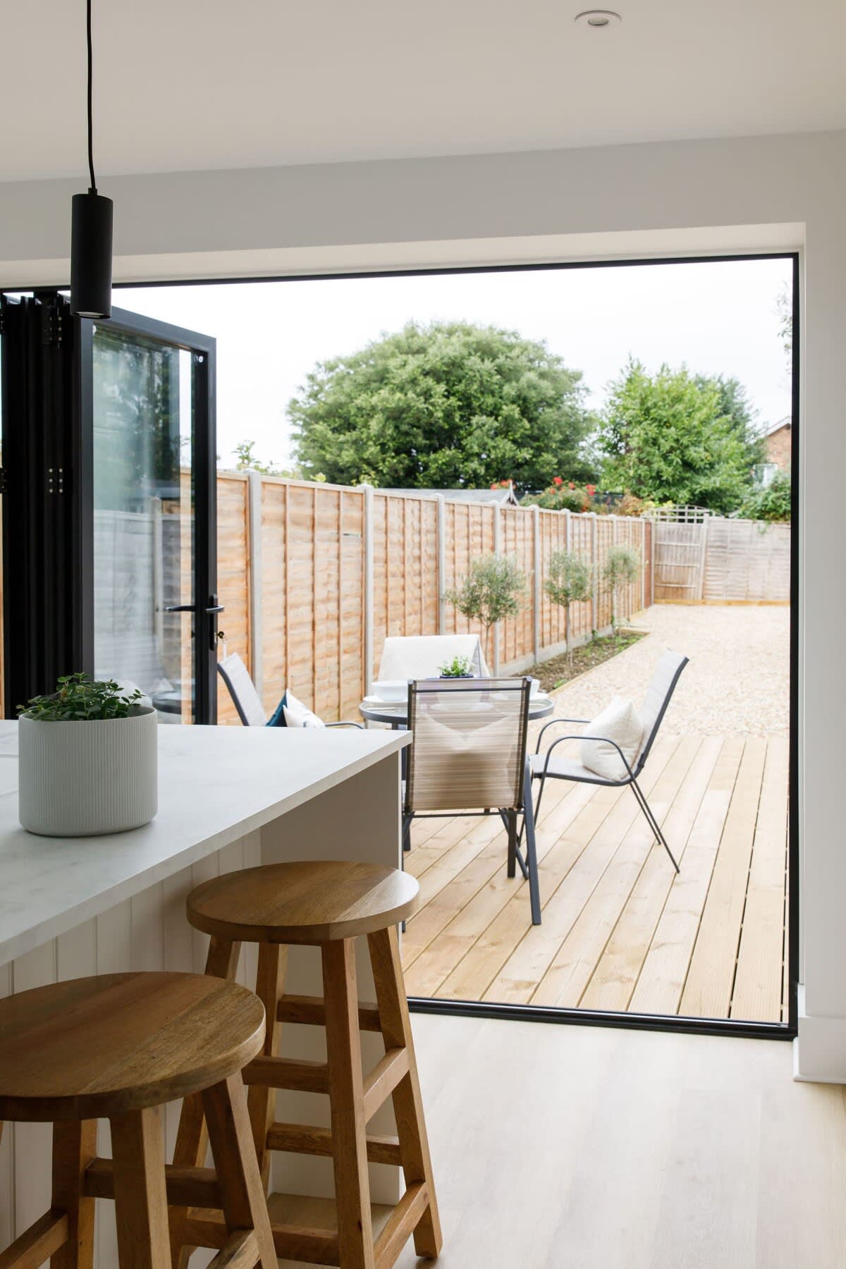 Open up the bi-fold door and head out from the kitchen to a perfectly manicured outside space.