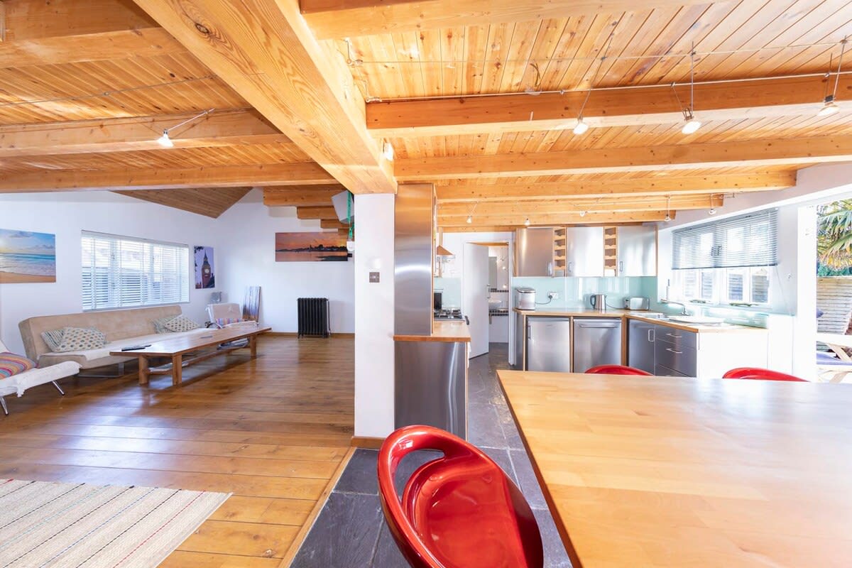 Dive into the heart of the house: a spacious open-plan kitchen, dining, and living area.