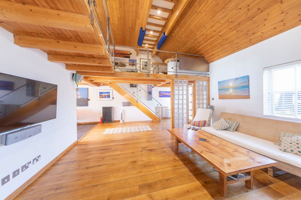 The living area has a large smart TV perfect for watching your favourite shows or films.