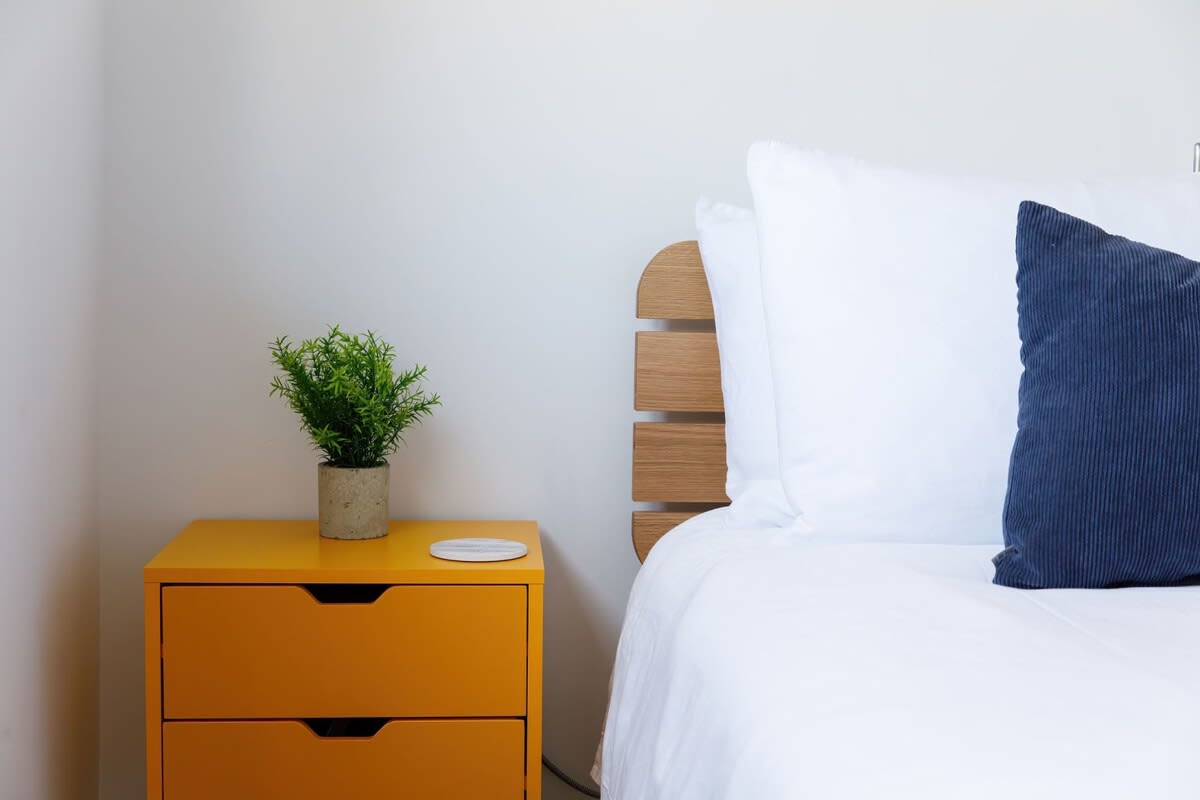 Bedside tables are in all bedrooms.