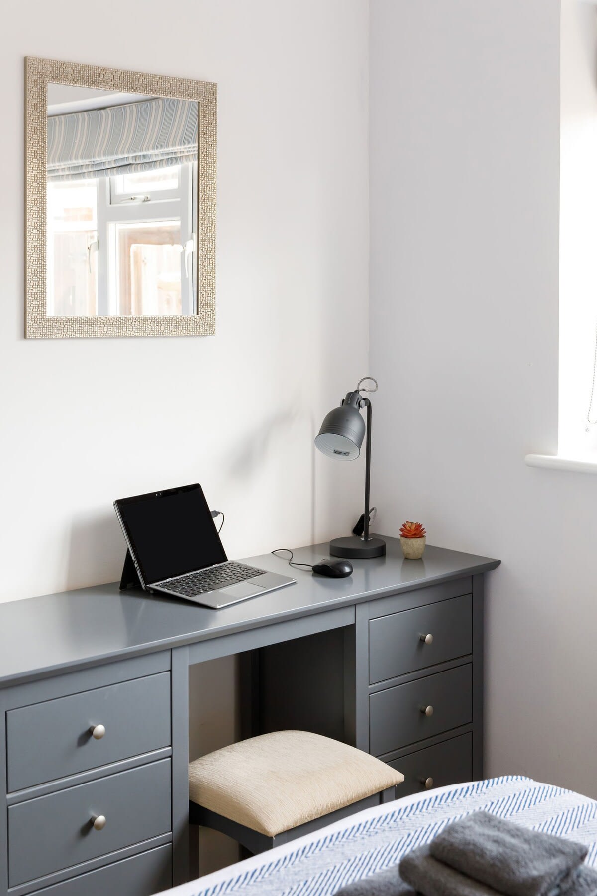 A vanity desk with drawers for all your personal belongings.