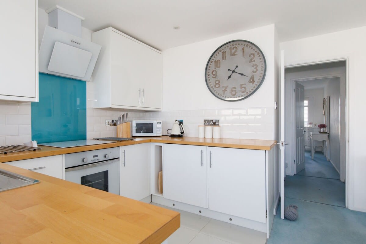 The apartment is clean and light, with plenty of kitchen space to prepare meals.