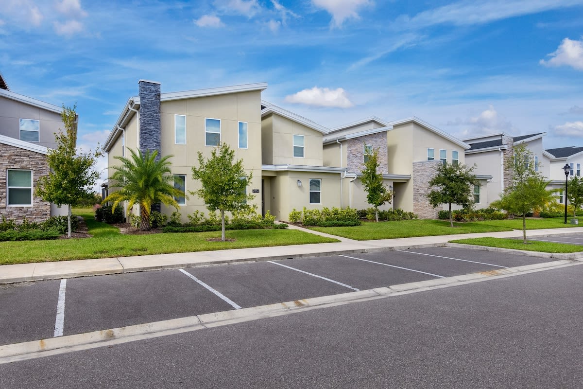 Modern retreat with lush landscaping and convenient parking, perfect for your next getaway.