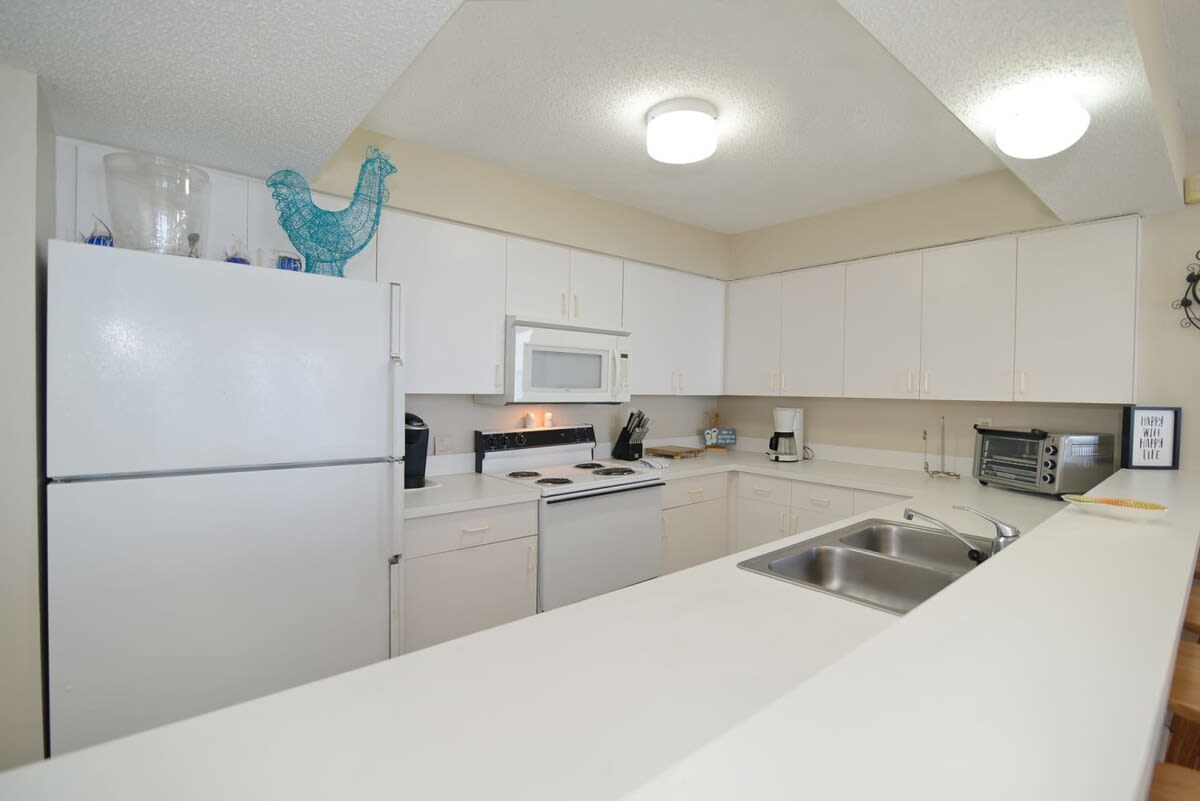 Kitchen Equipped with Keurig and Microwave Oven