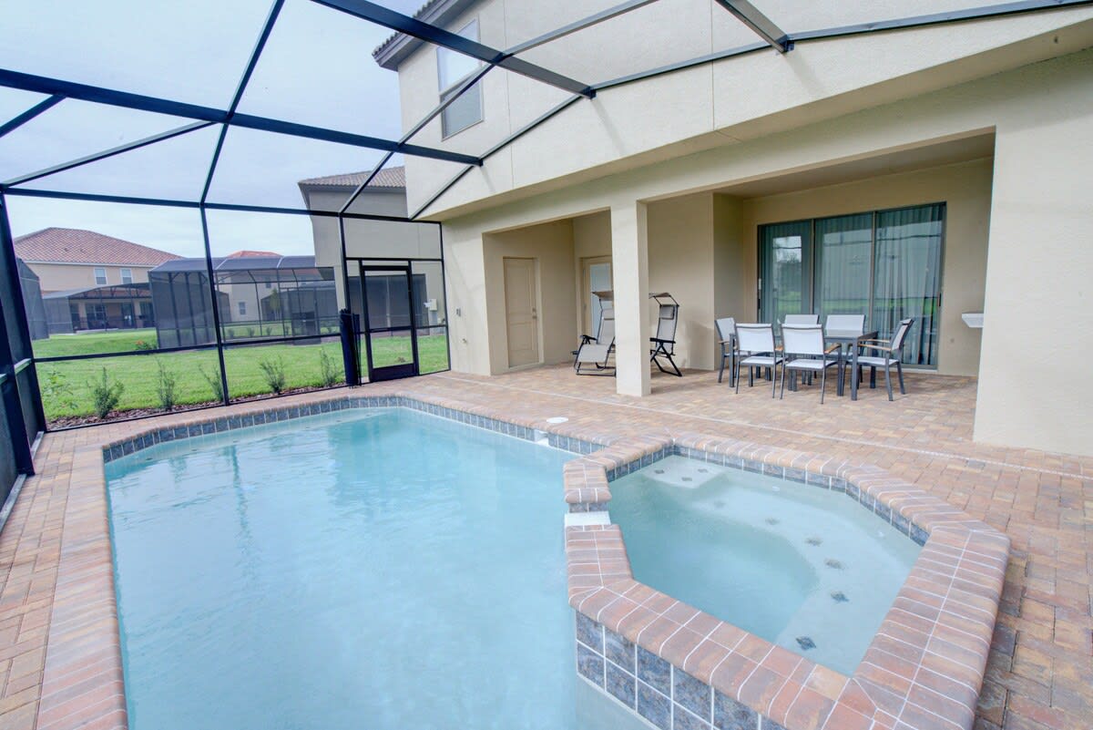 Relax in your private screened pool and hot tub oasis, perfect for unwinding after a day of adventure.