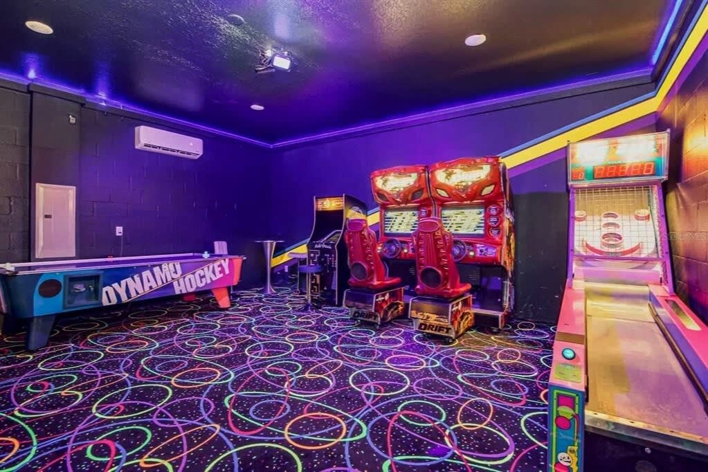 Unleash your competitive spirit in this lively game room with arcade classics, air hockey, and skee-ball, perfect for unforgettable fun.