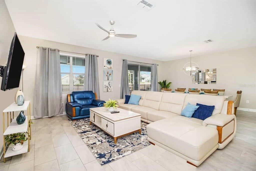 Spacious and elegant living area with plush seating, perfect for relaxation and entertaining in style.