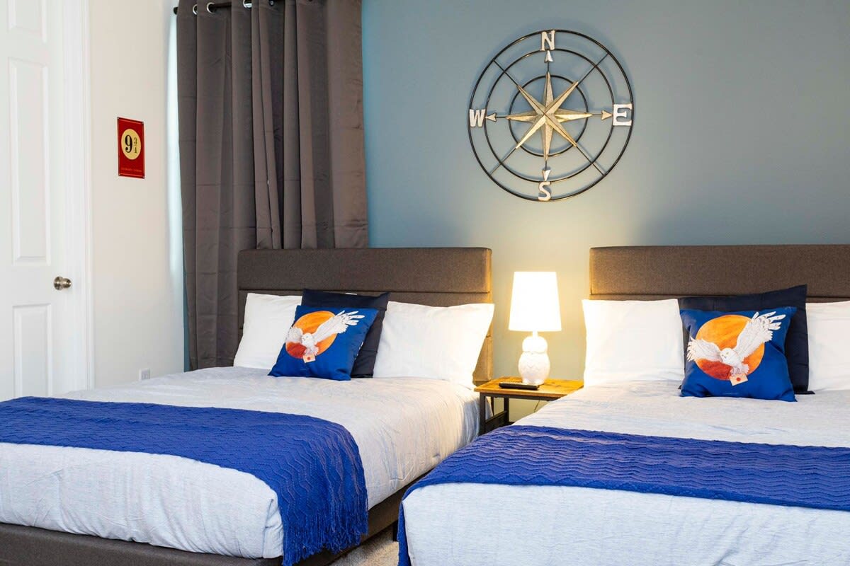 Cozy twin bedroom with nautical charm, perfect for a relaxing stay.