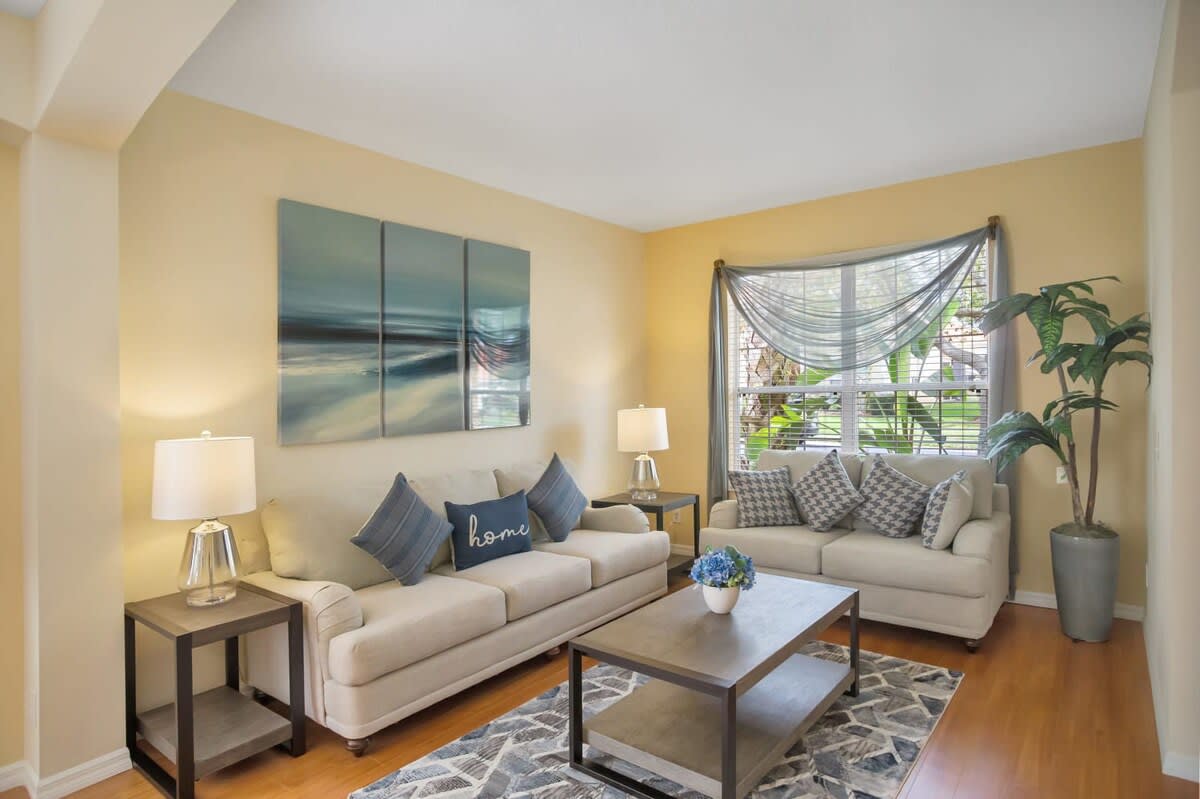 Cozy living room with plush sofas, ambient lighting, and a serene view—perfect for relaxation.