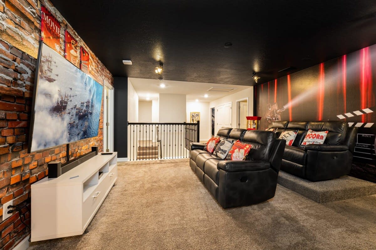 Experience movie magic in your private theater with plush seating and immersive decor, perfect for unforgettable family nights.