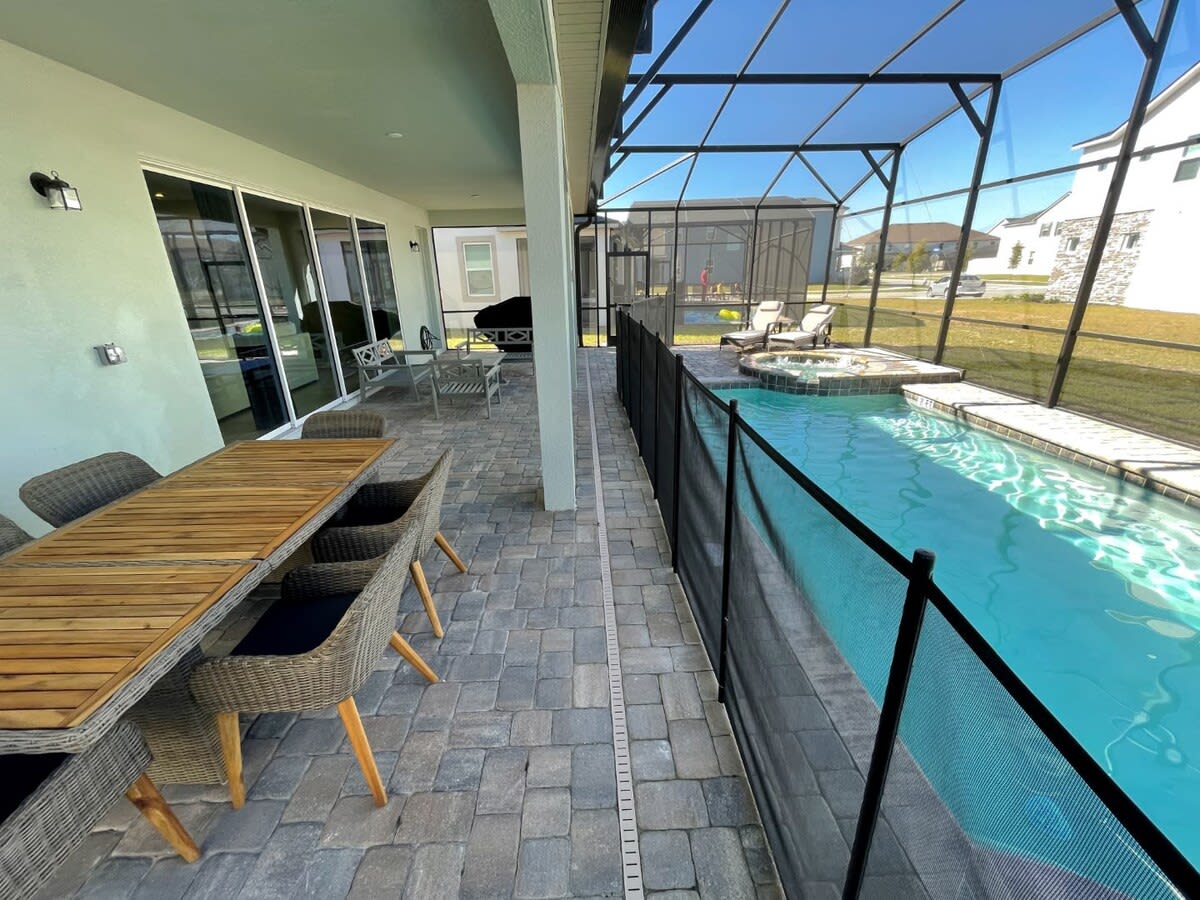Relax by your private pool and spa in this spacious outdoor oasis, perfect for family gatherings and sunbathing.