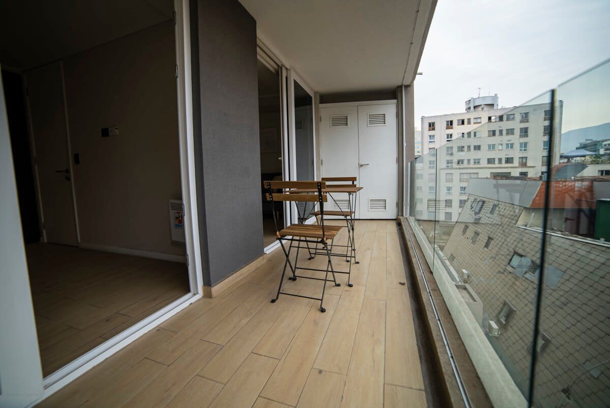 Enjoy a morning coffee on your private balcony with city views, perfect for relaxation.