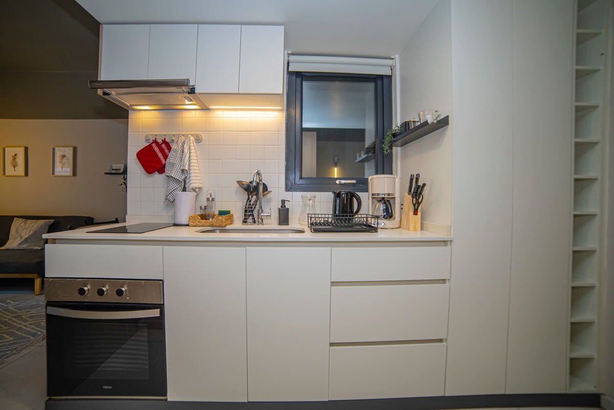 Modern and fully equipped kitchen perfect for preparing meals during your stay.