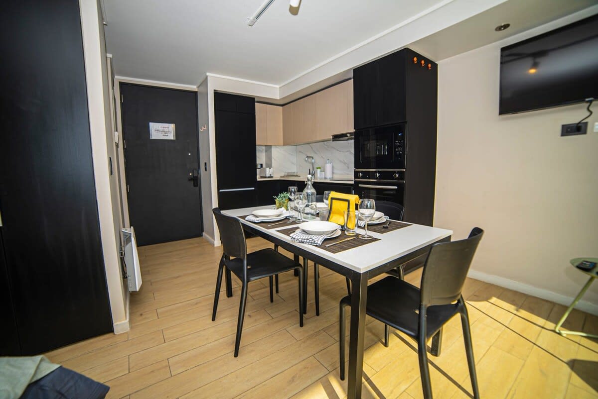 Chic and cozy kitchen-dining area perfect for intimate meals in a modern studio setting.