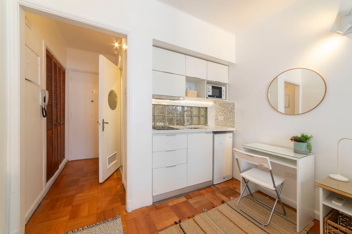 Cozy kitchenette with modern amenities and a convenient workspace, perfect for a comfortable stay.