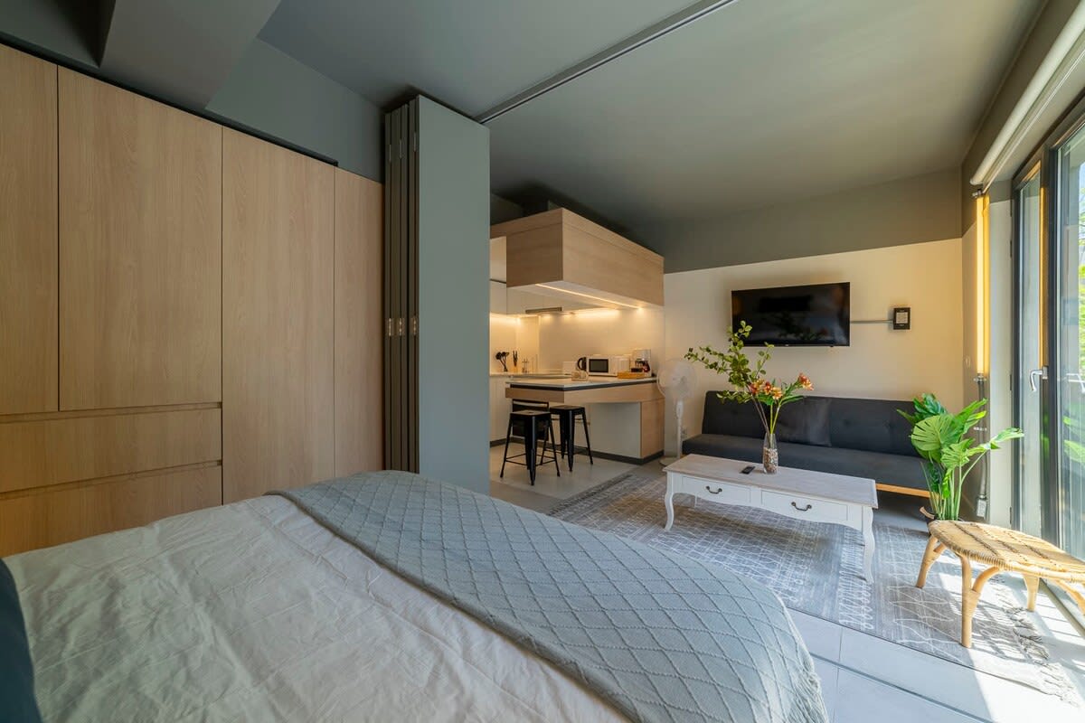 Experience cozy living in this modern studio with a stylish kitchen, comfy sofa, and abundant natural light.