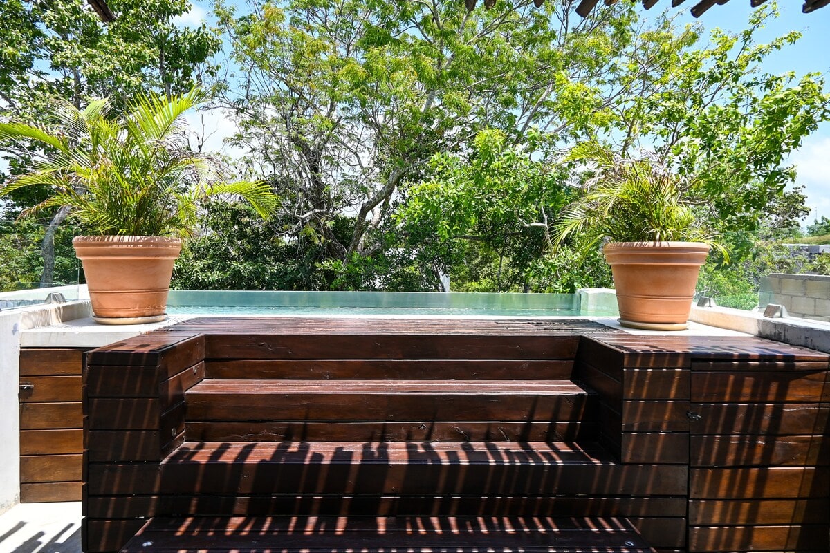 Beautiful plunge pool located on the rooftop, surrounded by natural vegetation