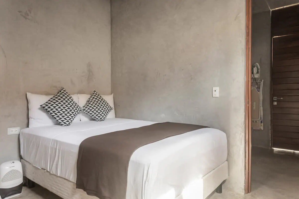 Main floor bedroom 1, with single bed and ensuite bathroom