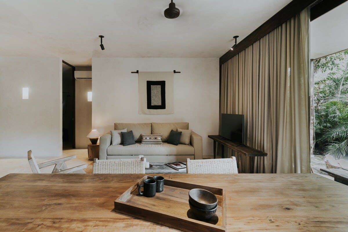 Cozy living-dining area with exterior views.