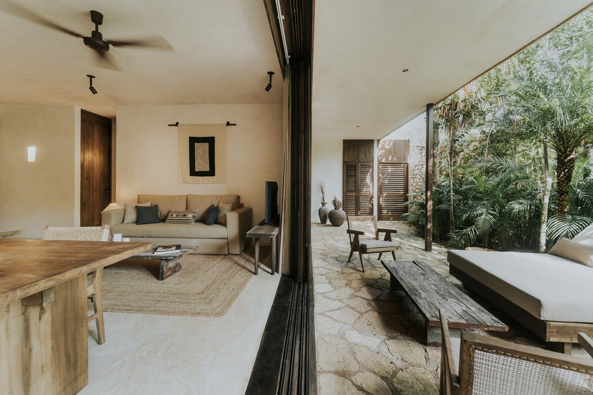 Floor-to-ceiling windows flood the room with natural light