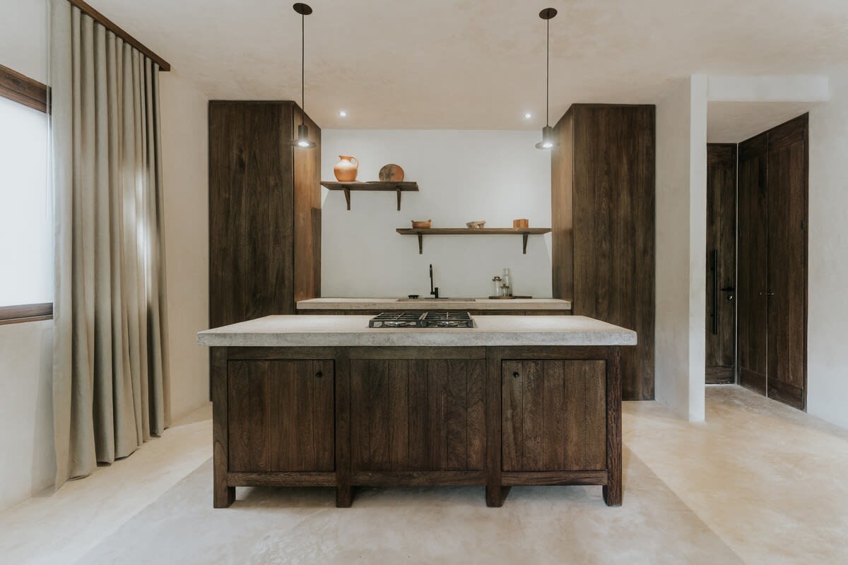 Fully equipped kitchen with wooden cabinets.