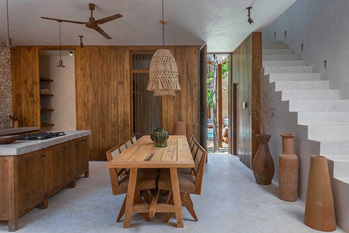 Dining room on the ground floor, with stairs leading to the second floor.
