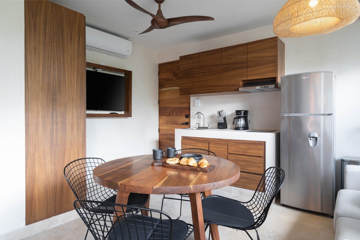 Bedroom with kitchen and dining area.