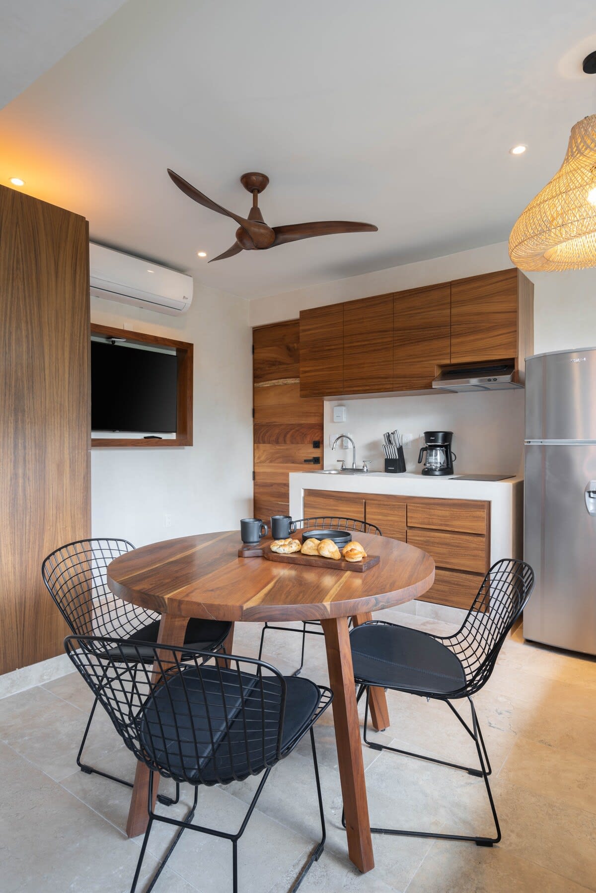Bedroom with kitchen and dining area.
