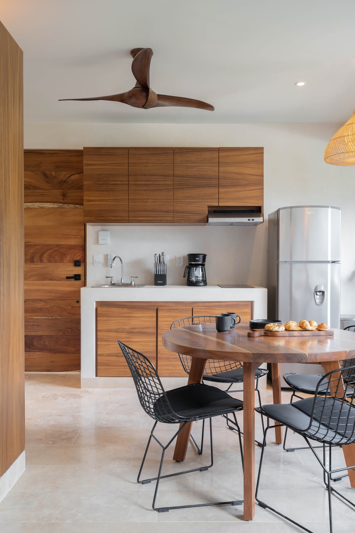 Complete kitchen and dining area in the bedroom.