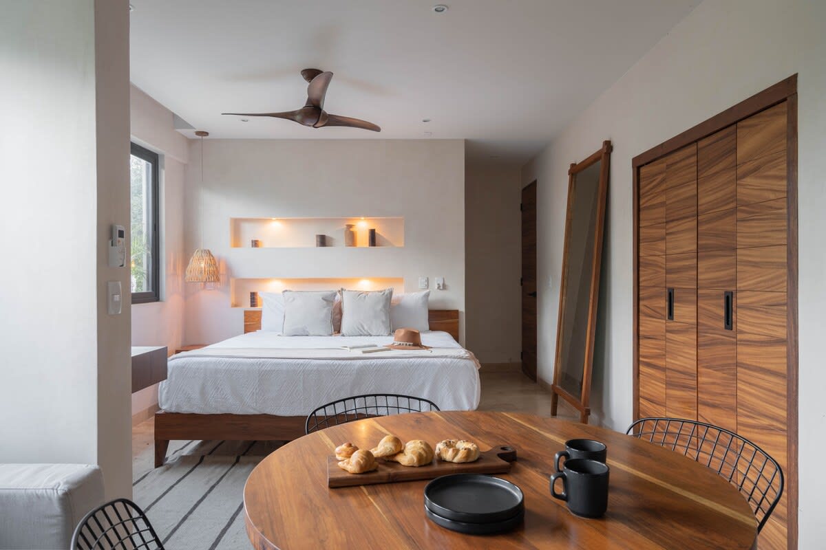 Bedroom with complete dining area and kitchen.