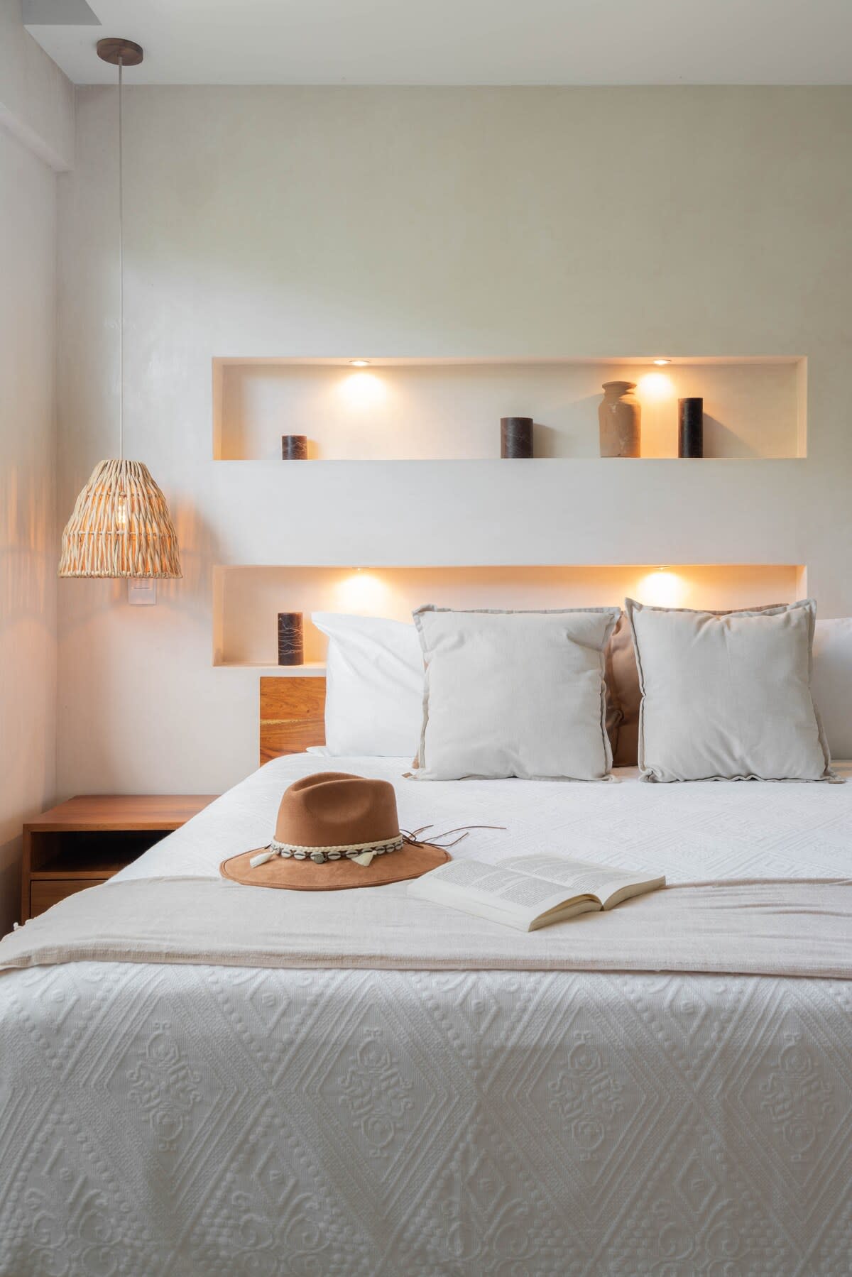 Spacious bedroom with a comfortable bed.