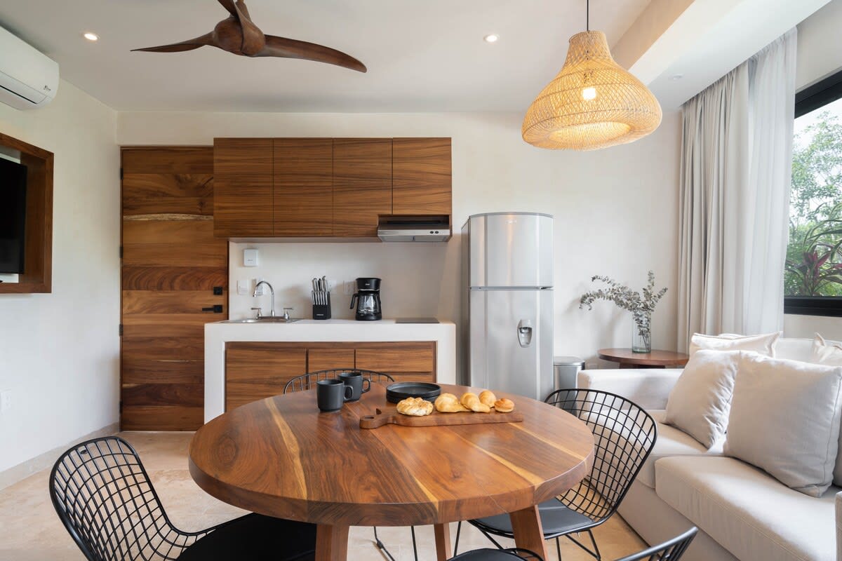 Bedroom with kitchen and dining area.