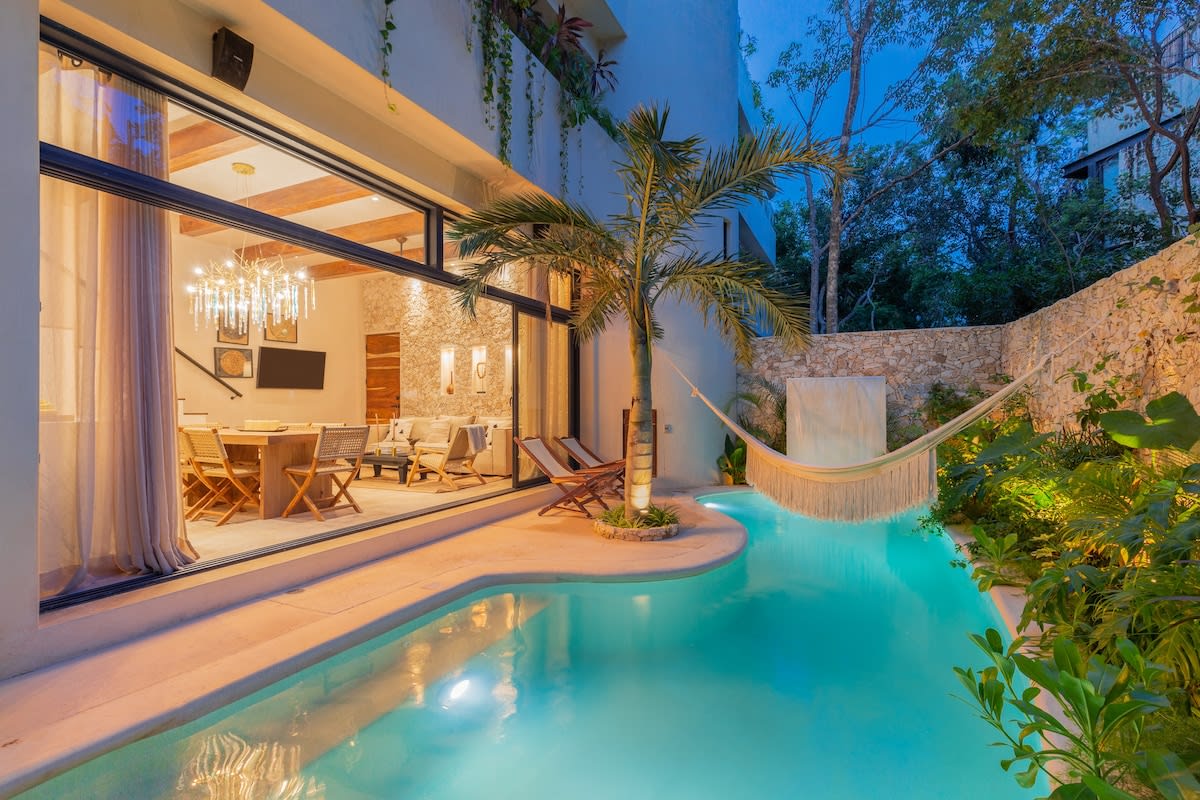 Private pool with hammocks and seating area, directly accessible from your living room.