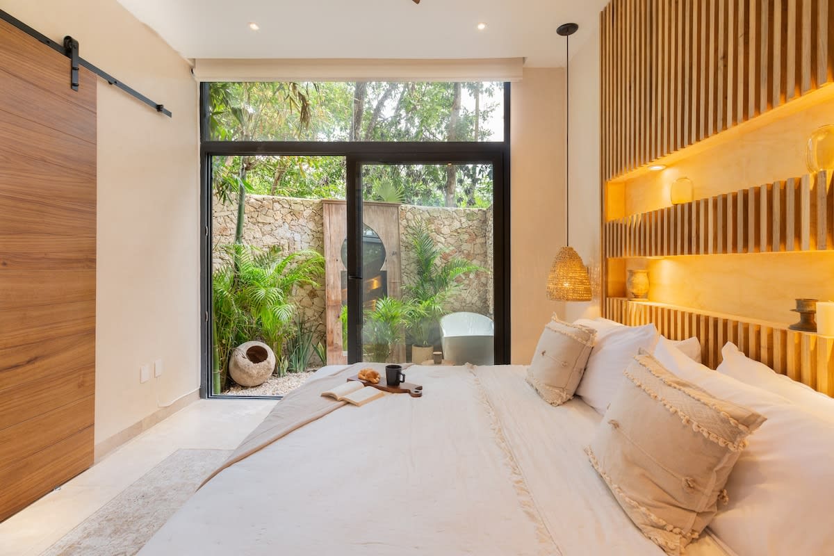 Master bedroom with private patio & outdoor tub.