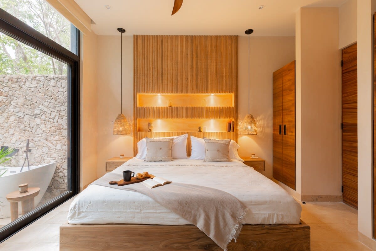 Master bedroom with private patio & outdoor tub.