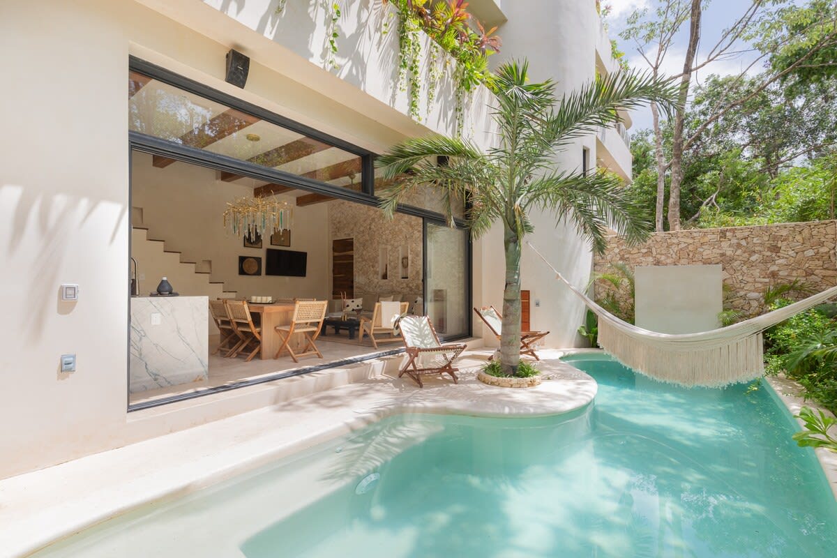Private pool with hammocks and seating area, directly accessible from your living room.