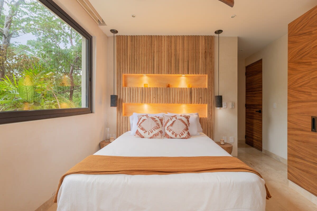 Bedroom #2, with ensuite kitchen, dining area, sofa, smart tv