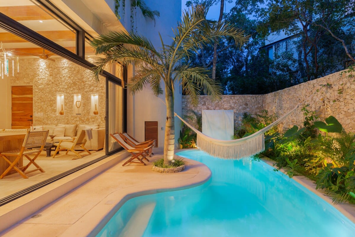 Private pool with hammocks and seating area, directly accessible from your living room.