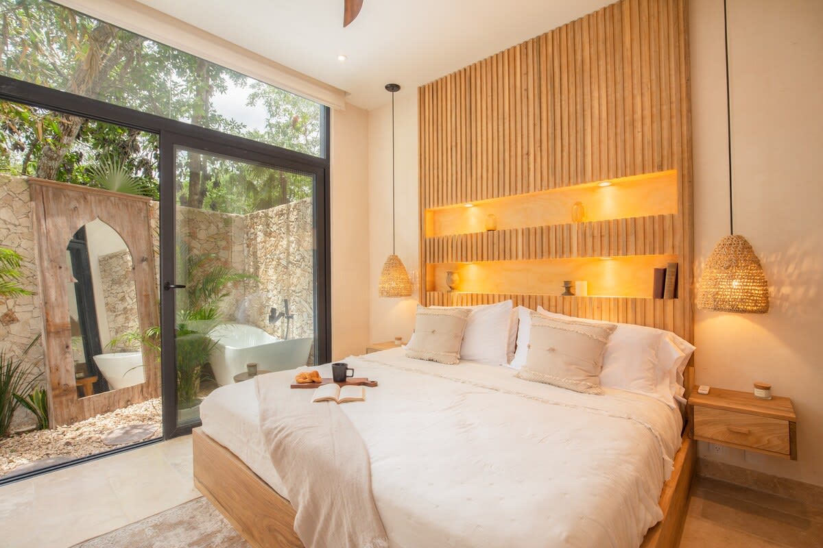 Master bedroom with private patio & outdoor tub.